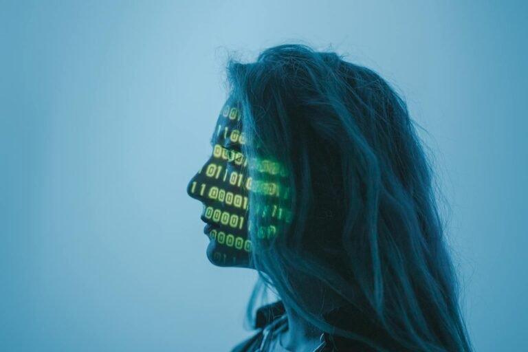 The &Amp;Quot;Agentic Web&Amp;Quot;: How Ai Agents Will Reshape The Internet 10 Silhouette of a woman with binary code projected on her face in a digital concept setting.