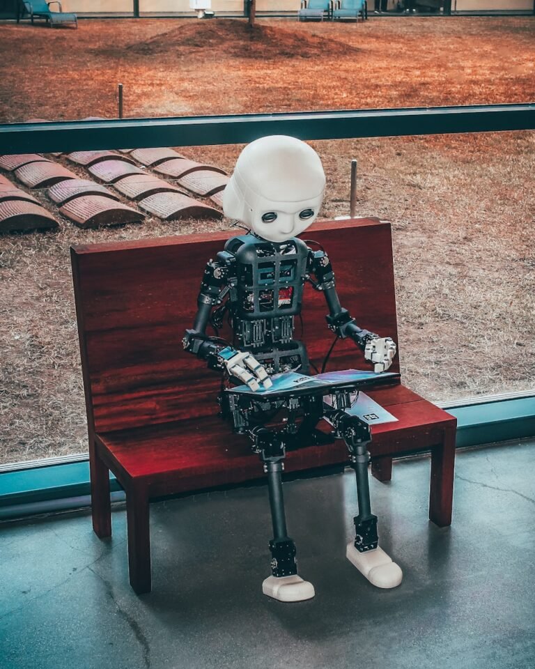 Logistics: How Ai Agents Can Manage And Optimize An Entire Supply Chain 2 Black and white robot toy on red wooden table